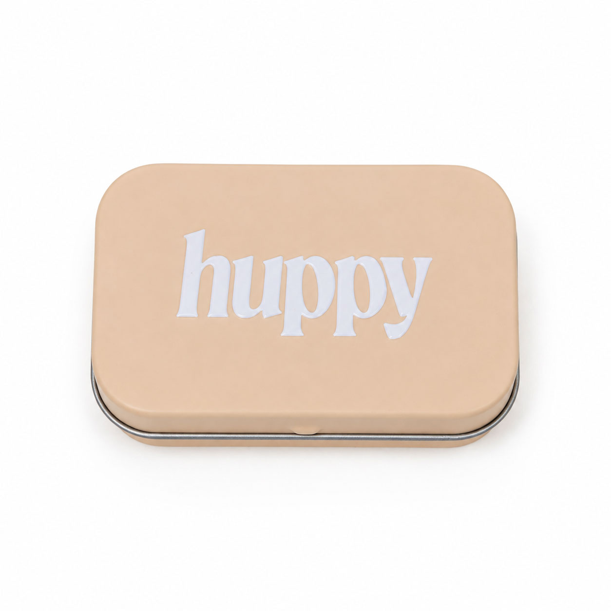 A closed, beige rectangular tin with "huppy" printed in white lowercase letters on the lid, on a white background.