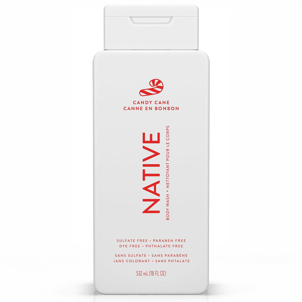 Front of a white Native Candy Cane body wash bottle with red bilingual text and candy cane graphic on white.