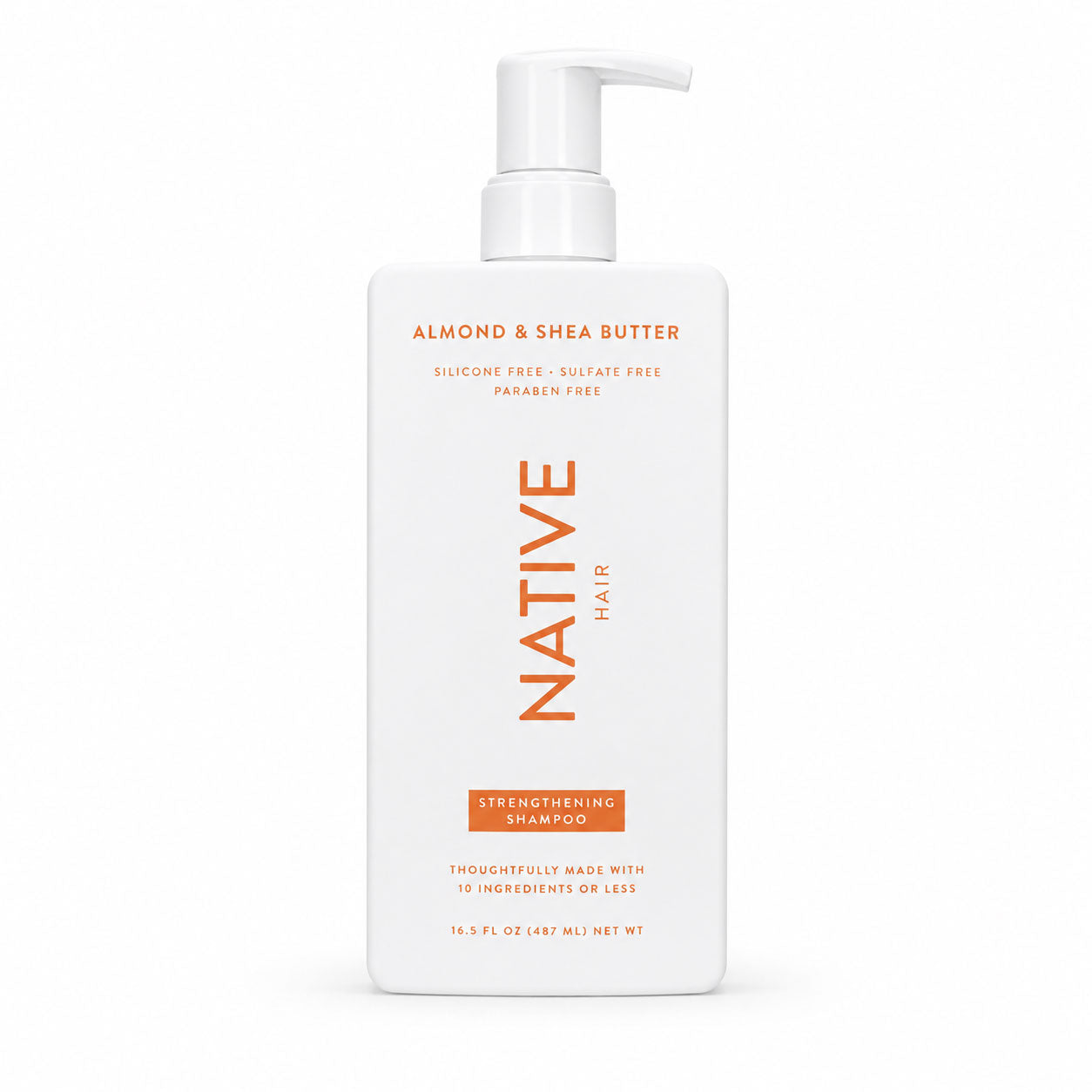 A tall white bottle of Native Hair Strengthening Shampoo with a white pump dispenser, featuring orange text on a clean white background.