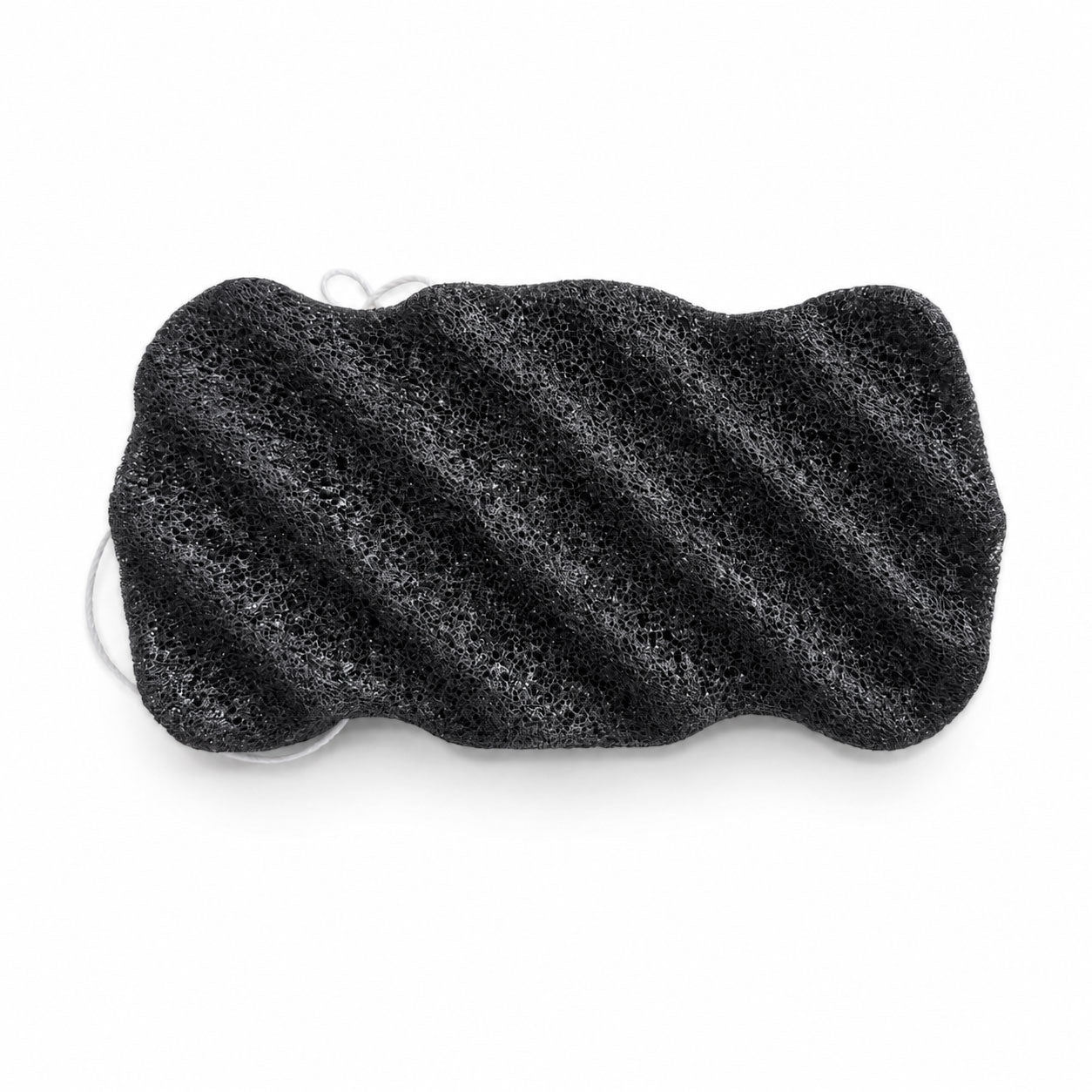 Charcoal black konjac body sponge with diagonal ridges and a white hanging string, on a white background.