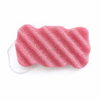 Dusty pink konjac body sponge with diagonal wavy ridges and a white hanging string on a white background.
