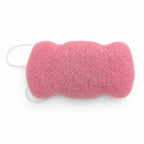 Flat, porous underside of a dusty pink konjac body sponge with a white hanging string on a white background.