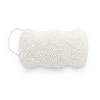 Flat, porous underside of a white konjac body sponge with an attached hanging cord, on a white surface.