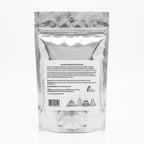 The back of a silver foil stand-up pouch with a white label featuring product information, directions, and a barcode.