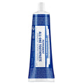 Dr. Bronner's peppermint toothpaste tube on a white background