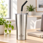 Brushed stainless steel Heritage tumbler with straw on a sunny home office desk