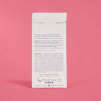 The back of a white paper envelope package for HiBAR, showing printed details and logos against a pink background.