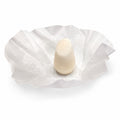 HiBAR Soothe conditioner bar, cream-coloured and unused, sitting on its opened white tissue paper wrap with no retail box