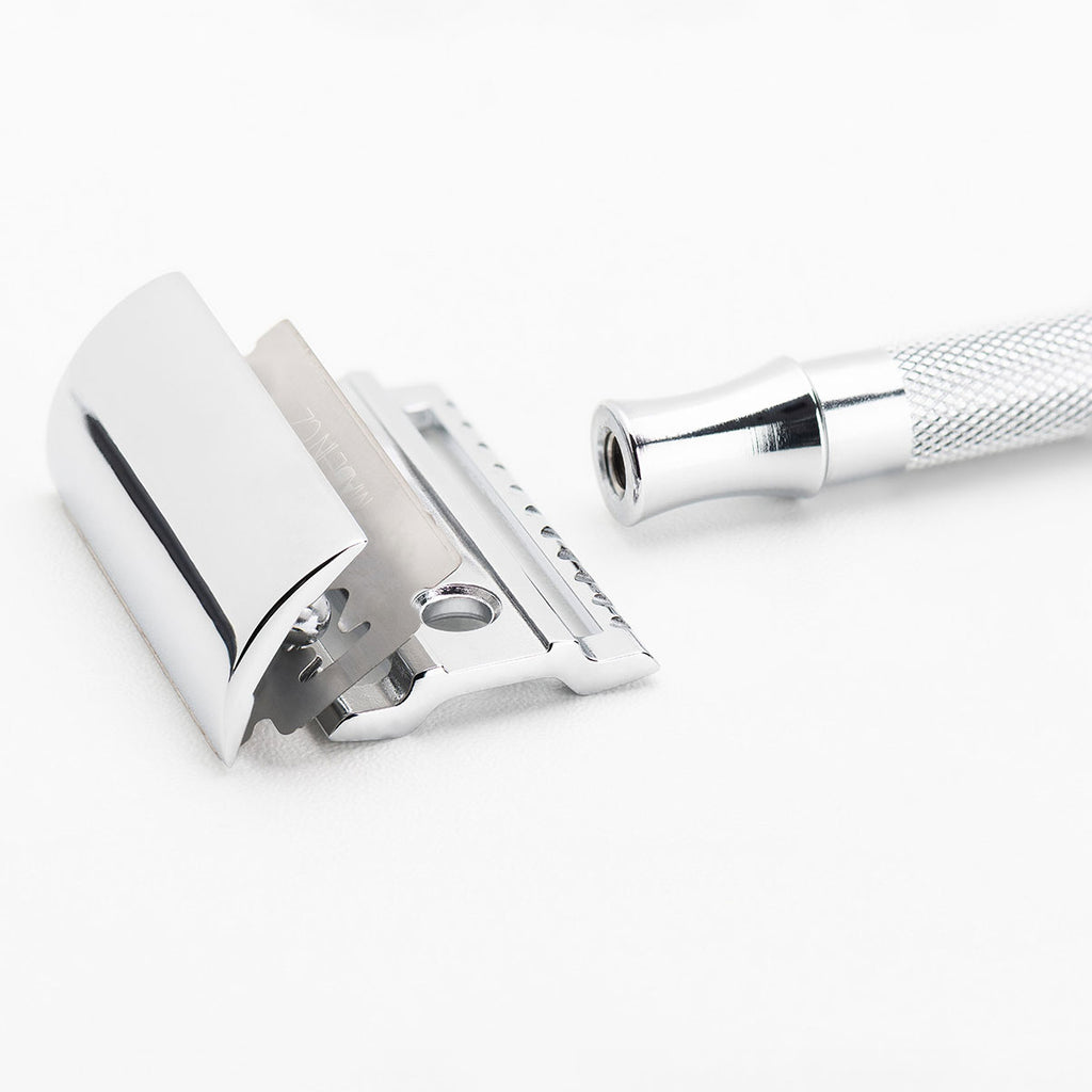 Close-up detail of Merkur 23C razor head showing the closed comb straight safety bar design, chrome-plated die-cast zinc construction, generous blade gap spacing, and precision German engineering from SolingenShareArtifactsDownload allRockwell 6s product copyDocument · MD Project contentAI-Optimized Product Page GeneratorCreated by youAdd PDFs, documents, or other text to reference in this project.Content