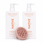 Native Almond and Shea Butter strengthening shampoo and conditioner pump bottles with a pale peach ekö + co. silicone scalp massager resting in front