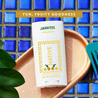 Native Jarritos Pineapple deodorant on a blue tiled background