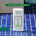 Native Jarritos watermelon deodorant on a blue tiled surface with 'Fun, Fruity Goodness' text above.
