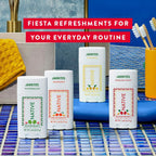 Four Jarritos-inspired Native deodorant varieties including Watermelon, Mandarin, Pineapple, and Passion Fruit displayed together on blue woven surface with text "Fiesta Refreshments for Your Everyday Routine"