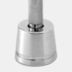 Close-up of Rockwell razor stand with safety razor inserted showing proper upright storage position that allows water drainage and blade drying.
