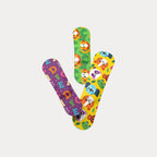 Three patterned flex fabric bandages in purple alphabet, green lion, and yellow animal face designs.