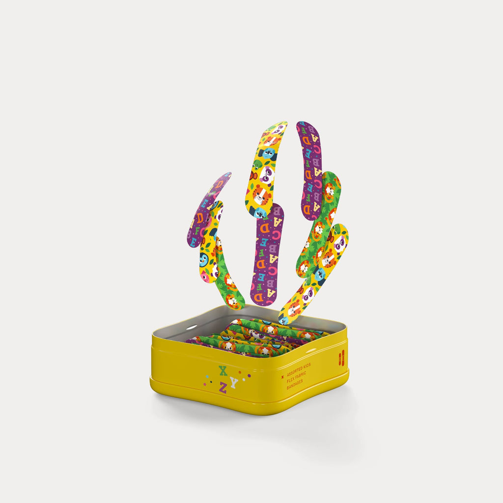 Open yellow tin filled with individually wrapped bandages as colourful patterned strips float above.