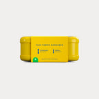Side view of the yellow tin wrapped in a yellow paper sleeve indicating 48 flex fabric bandages inside.