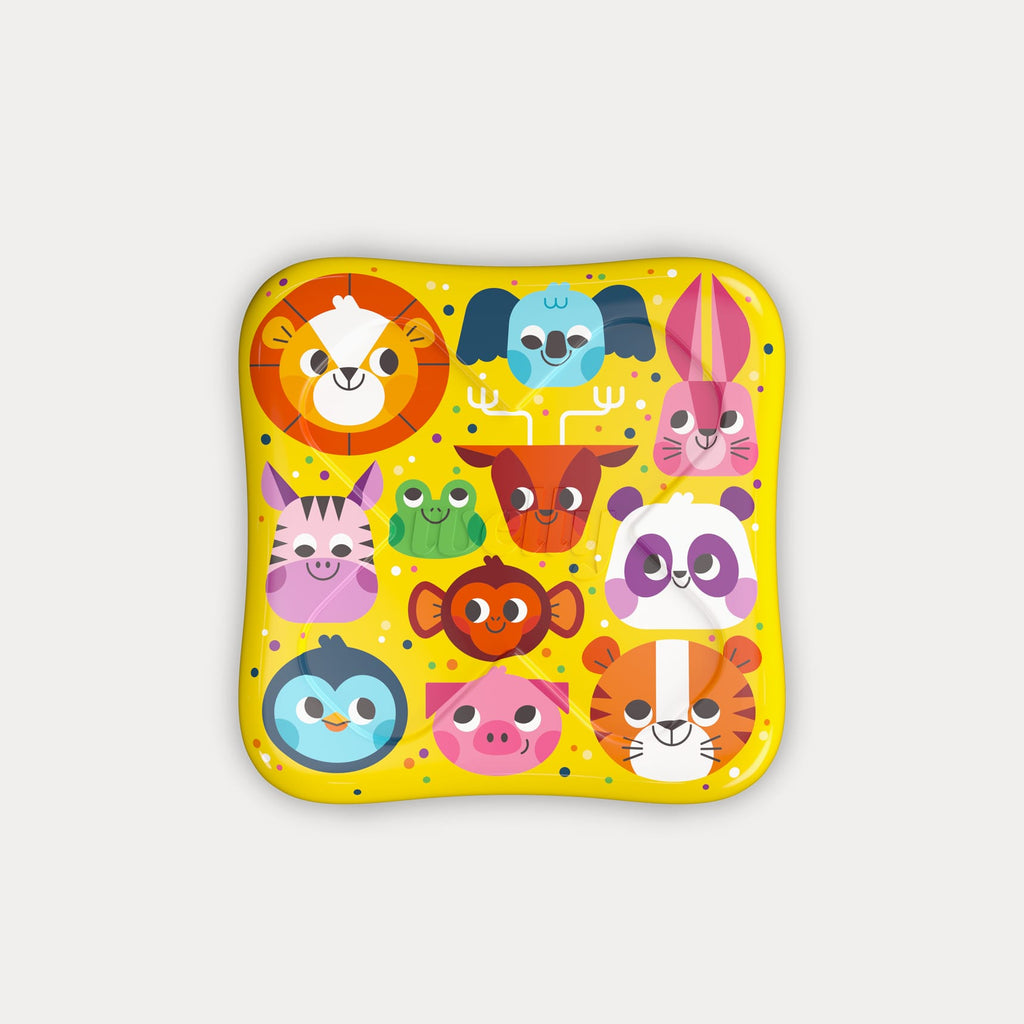 Top-down view of the square yellow tin lid covered in colourful cartoon zoo animal face illustrations.