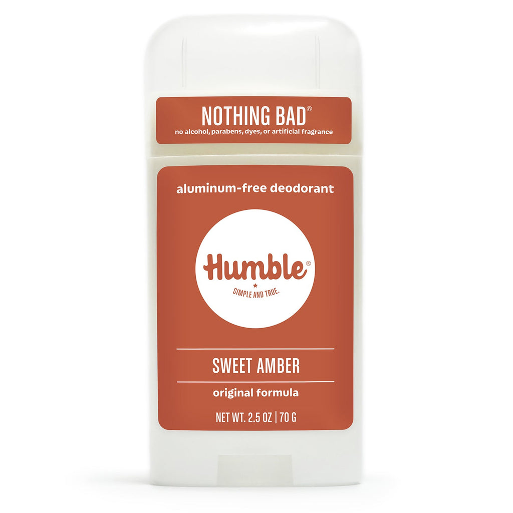 Front view of a white Humble Sweet Amber aluminum-free deodorant container with a terracotta-colored label, on white.