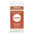 Front view of a white Humble Sweet Amber aluminum-free deodorant container with a terracotta-colored label, on white.