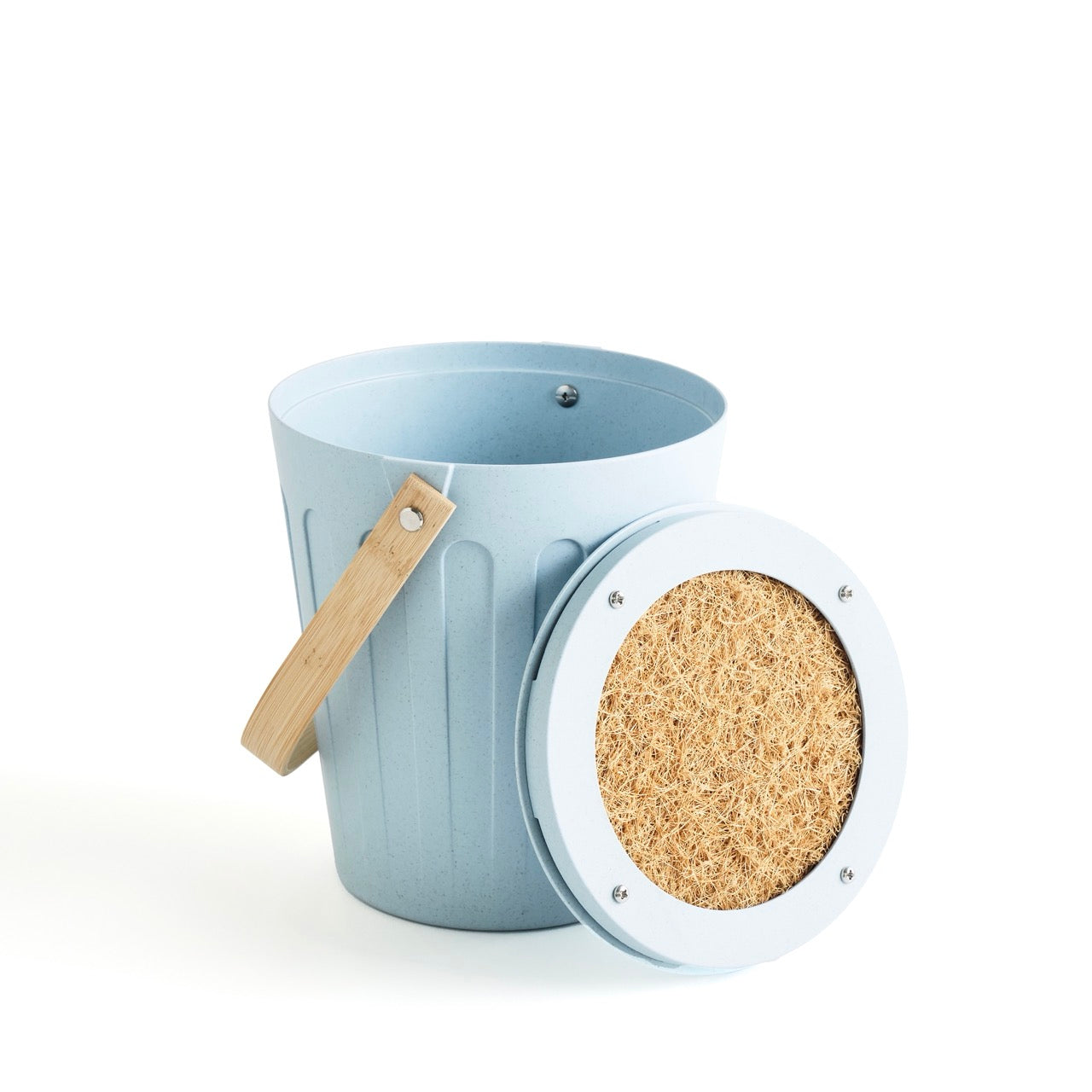Martha Stewart light blue indoor compost bin with its lid open, revealing a filter on the underside.