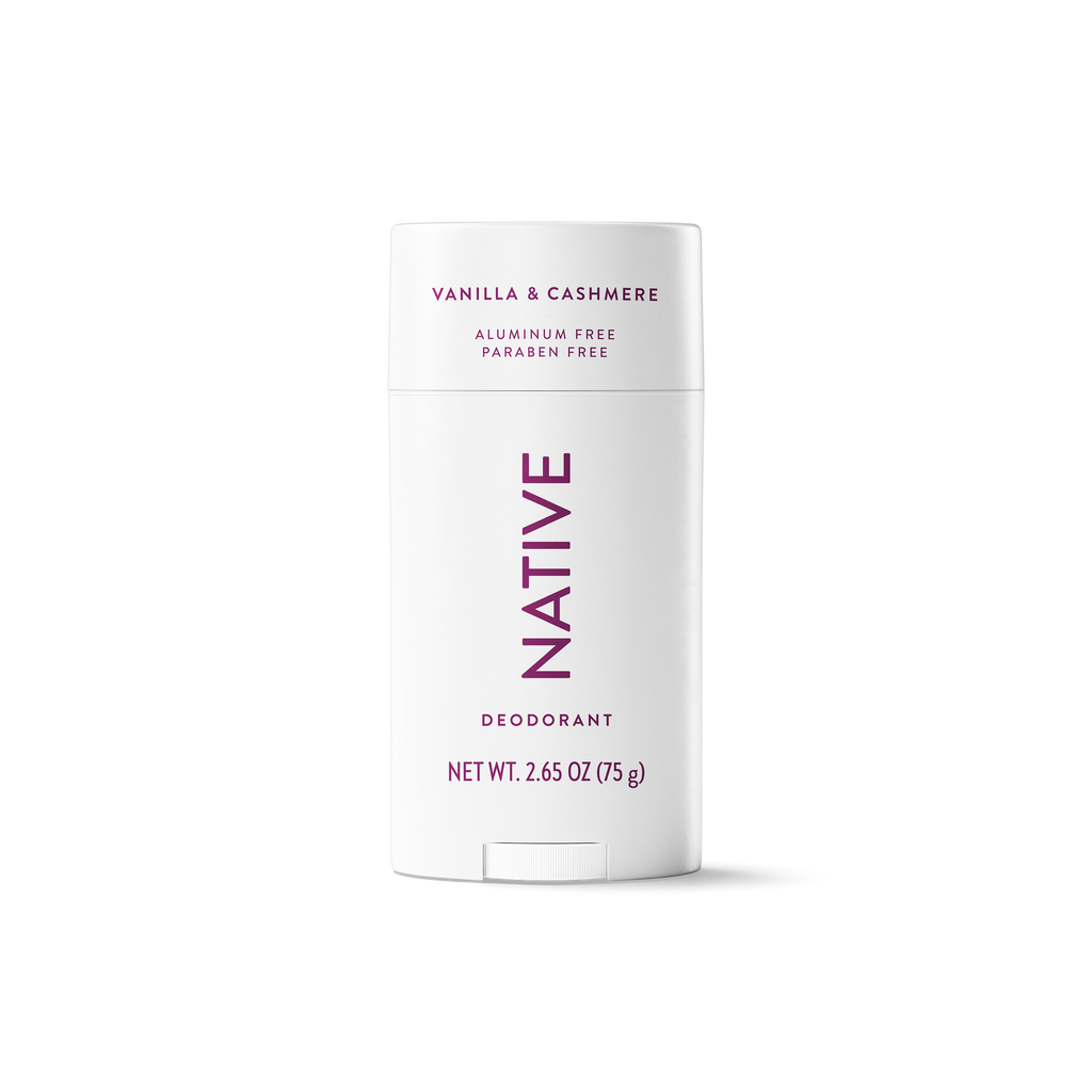 White stick of Native Vanilla & Cashmere deodorant with purple lettering centered against a solid black background.