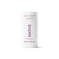 White stick of Native Vanilla & Cashmere deodorant with purple lettering centered against a solid black background.