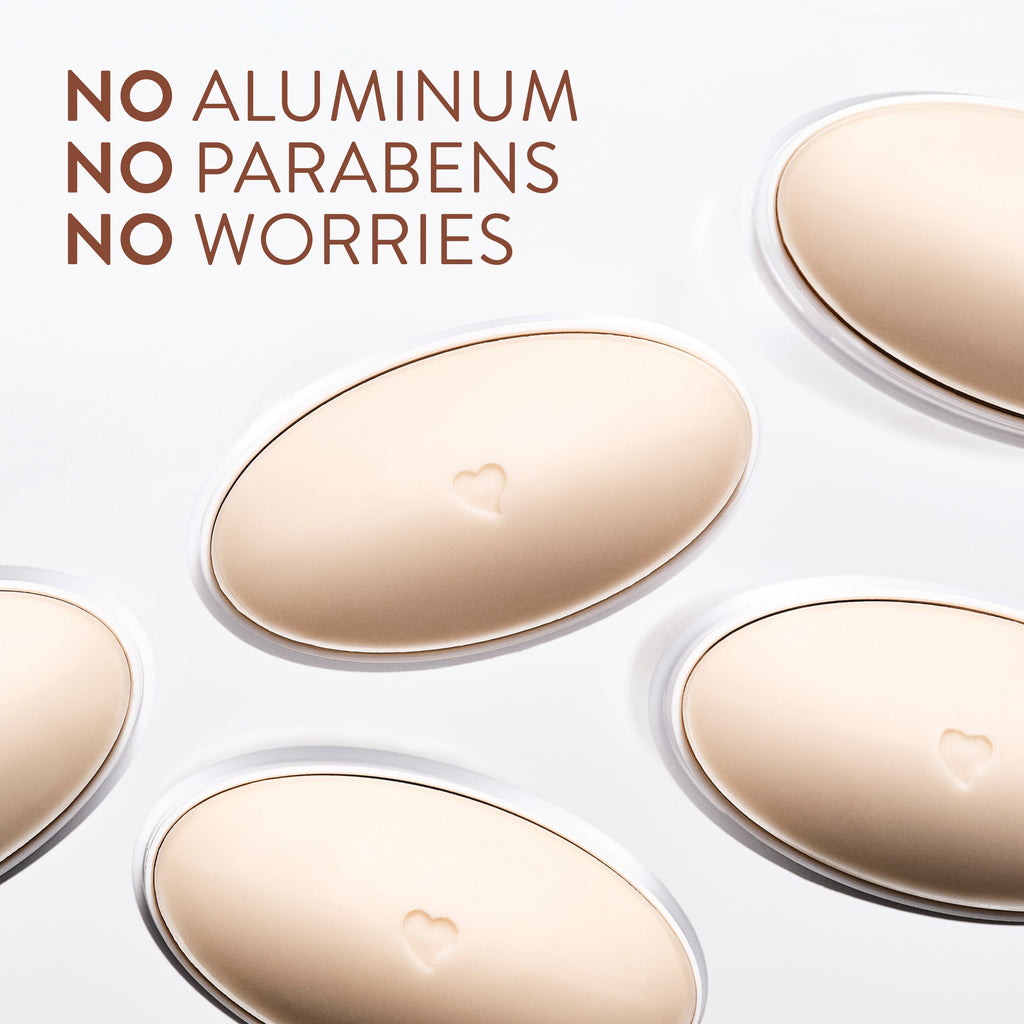 Oval-shaped beige deodorant sticks with a heart detail shown from above beside text on a white background.