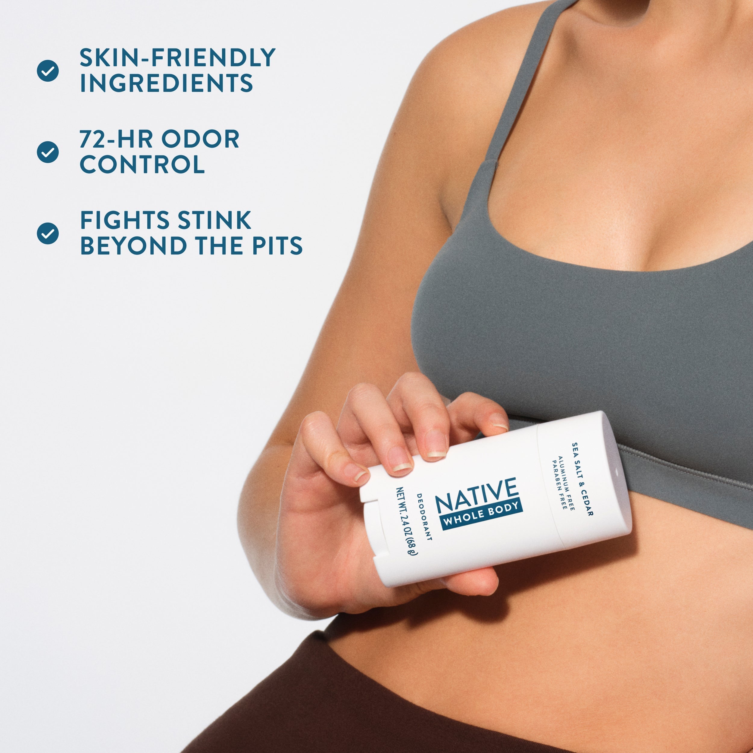 Someone in a grey sports bra holding a Native deodorant stick next to three benefit checkmarks.