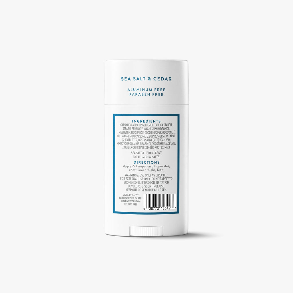 Back label of a Native Whole Body Deodorant stick showing ingredients and directions, on a grey background.