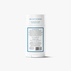 Back label of a Native Whole Body Deodorant stick showing ingredients and directions, on a grey background.