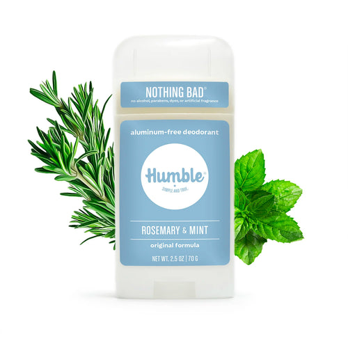 Humble Rosemary & Mint deodorant stick on a white background, flanked by fresh green rosemary and mint sprigs.