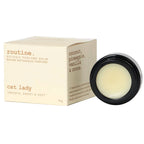 Routine Cat Lady solid perfume - cream packaging box with tropical scent description and black jar showing smooth balm texture - 15g botanical perfume balm