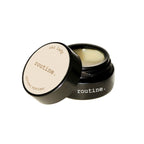 Routine Cat Lady solid perfume - black glass jar with cream label open showing smooth balm texture - natural coconut pineapple vanilla scented moisturizing perfume