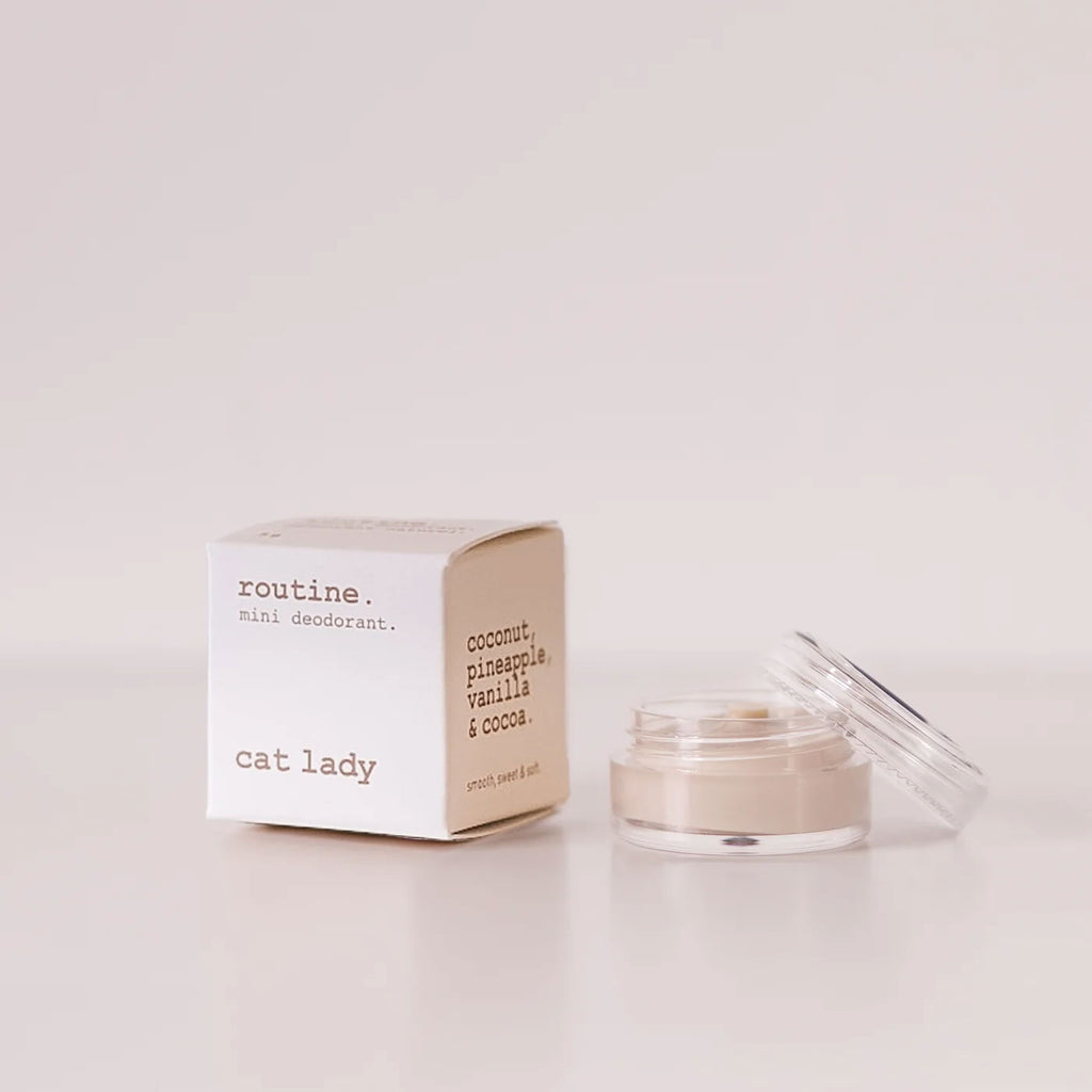 Routine Cat Lady vegan deodorant mini - cream cardboard box beside open glass jar showing light cream deodorant