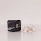 Routine Johnny's Cash baking soda free mini deodorant showing black cardboard packaging next to open glass jar containing cream-coloured natural forest-scented deodorant
