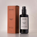 Routine Maggie's Farm Natural Mist - black glass spray bottle with coral-coloured packaging box showing 200ml multi-use body hair and atmosphere formula with bohemian scent blend