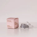 routine Moon Sisters mini deodorant - pink cardboard box beside open glass jar showing grey cream deodorant - floral natural formula with rose neroli lavender and vetiver