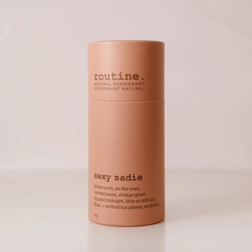 Sexy Sadie Natural Deodorant stick on a white countertop showing minimalist eco-friendly packaging.