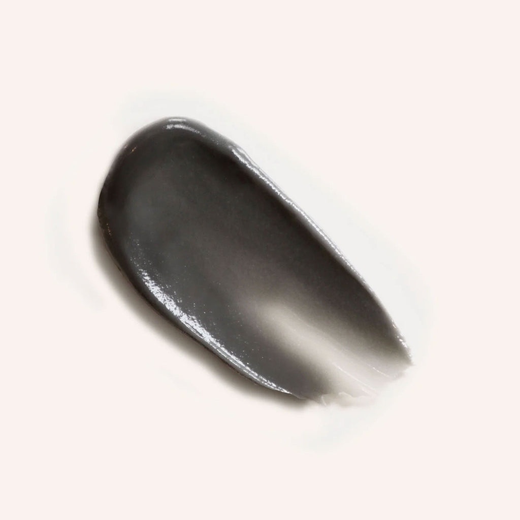 Close-up of routine Superstar deodorant cream texture - smooth dark grey charcoal-infused formula showing rich consistency for effective odour elimination