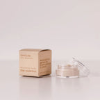 Routine The Curator baking soda-free deodorant mini - cream cardboard box beside open glass jar showing light cream deodorant