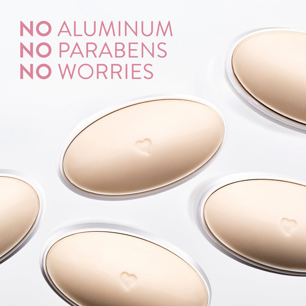 Five oval-shaped deodorant sticks, each embossed with a tiny heart, on a white background with pink text.