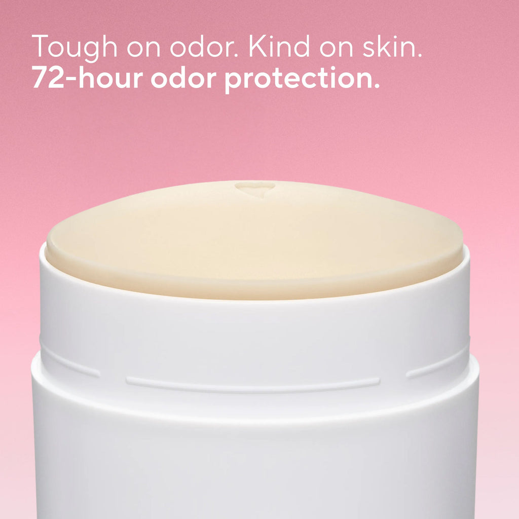 Close-up of an open Native deodorant container showing the dome of product with a tiny heart imprint on top.