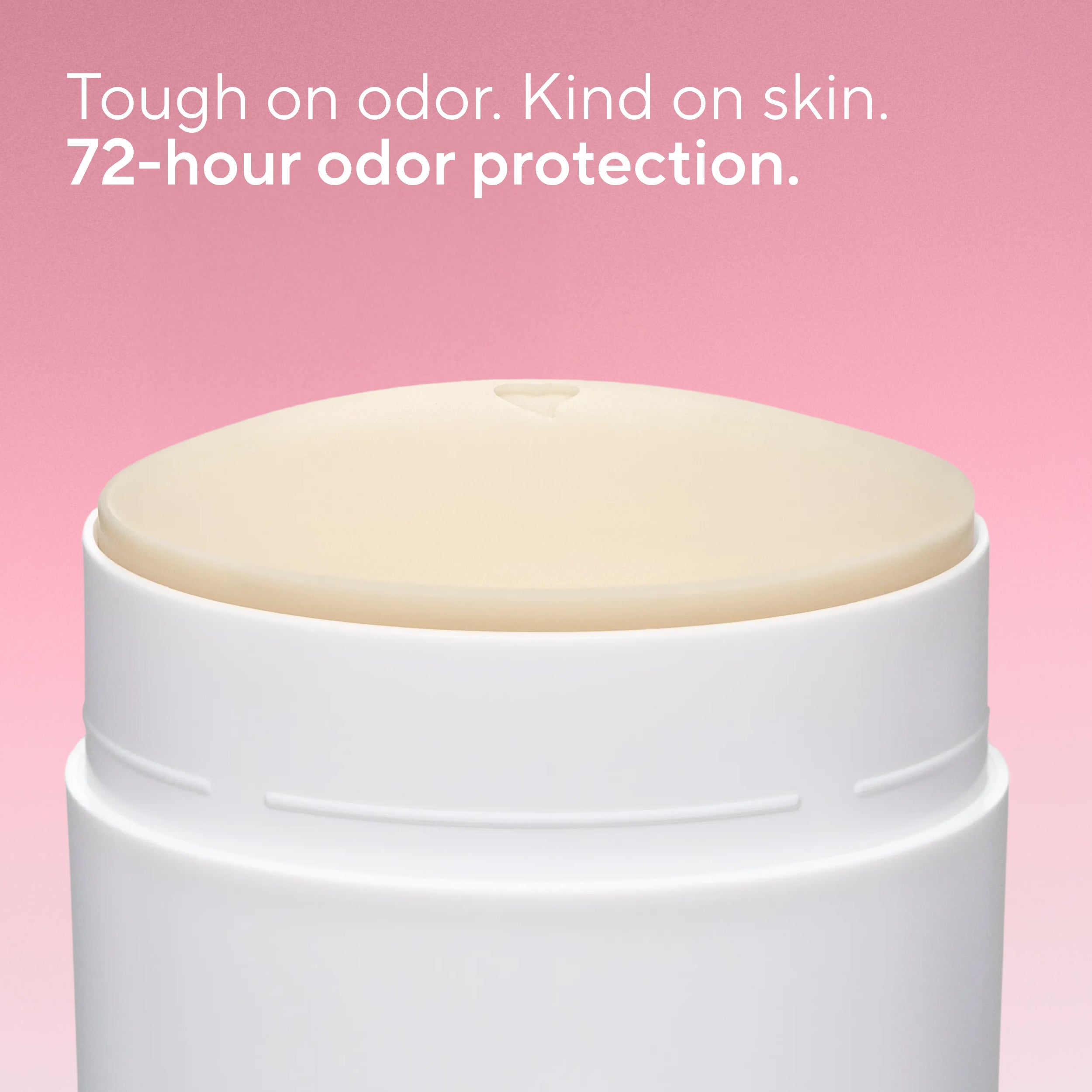 Close-up of an open Native deodorant container showing the dome of product with a tiny heart imprint on top.