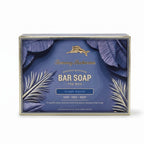 Front of Tommy Bahama Ocean Waves Bar Soap for Men box featuring gold marlin logo, palm leaf illustration, and 10 oz / 283 g net weight on navy background