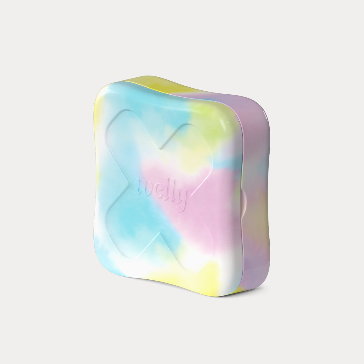 Angled three-quarter view of the closed tie-dye tin, showing a large embossed X with the brand name "welly."