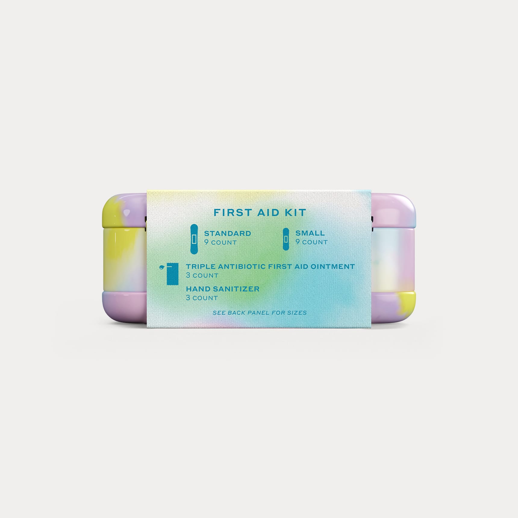 The side of the paper wrapper listing kit contents with blue icons against a pastel gradient background.