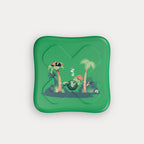 The bottom of the green metal tin featuring a cartoon turtle sleeping in a hammock between two palm trees.