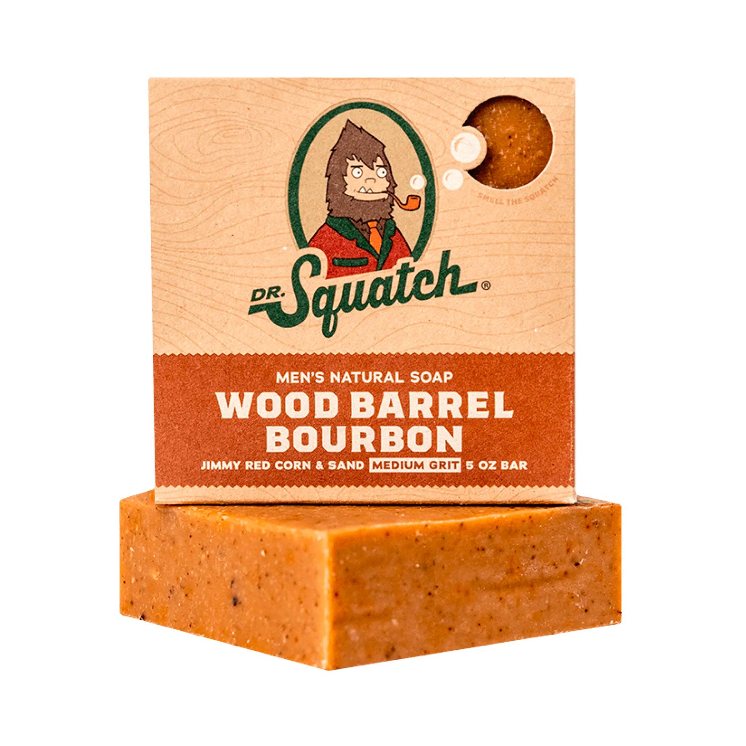 A rectangular bar of soap with a textured brown color, placed in front of its packaging which features the Dr. Squatch logo and the text 'MEN'S NATURAL SOAP WOOD BARREL BOURBON'.